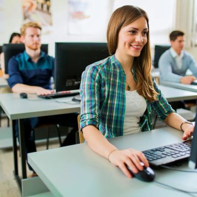 Students working on computers in a classroom.
