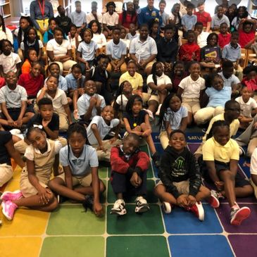 Group image of children sitting on the floor