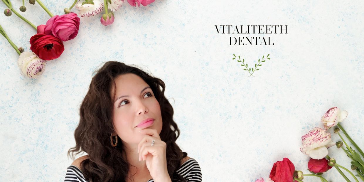 Woman holding chin looking up at logo surrounded by roses Monica Cordova VitaliTeeth Dental