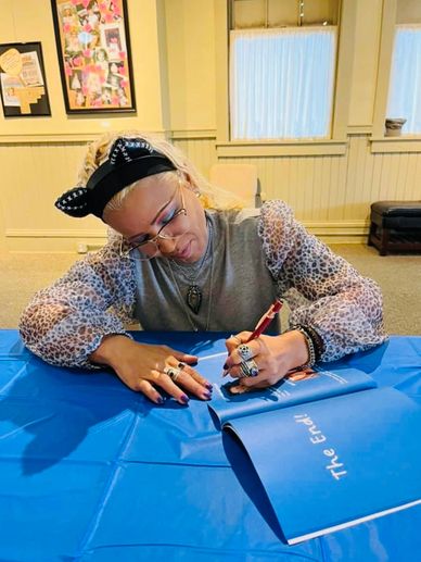 Stef Parker signing her childrens book 'there are monsters in my room'