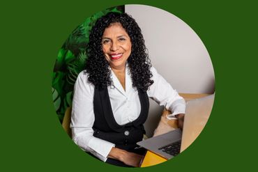 a woman in professional attire is smiling 