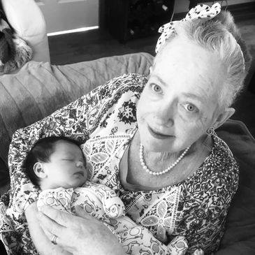 Gwunnie holding a baby, Grandma lovingly holding a newborn baby #Gwunnies
