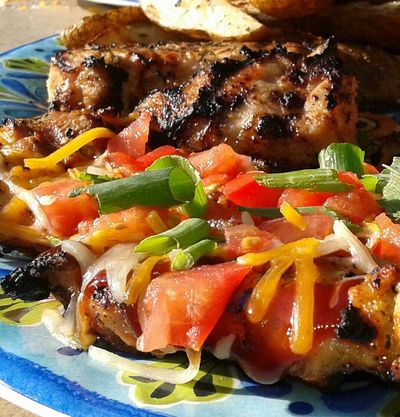 Santa Fe chicken, mojo marinated pork chops, and seasoned potato wedges