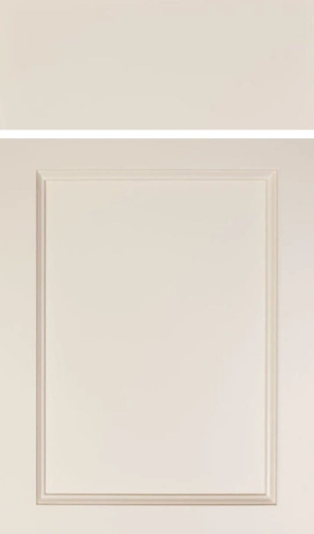 Close-up of a cream-colored door panel with decorative molding.