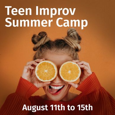 A woman playfully puts orange slices in front of her eyes. Teen improv summer camp for rogue studios