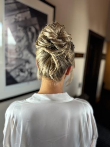 Twisted High Bun 
High texture bun hairstyle with an elegant twist creating a modern and elevated si
