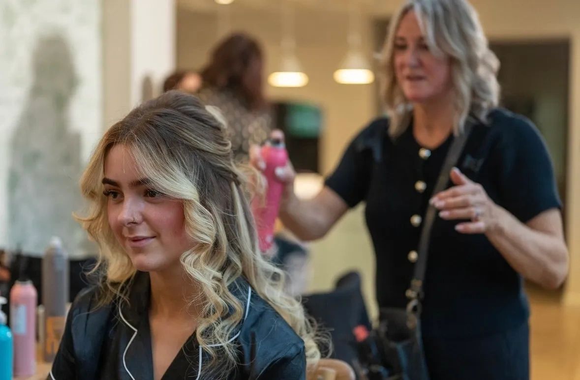 Woman getting her hair styled in a salon.
