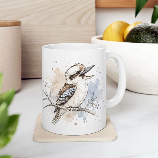 White mug with bird illustration sits on a coaster.
