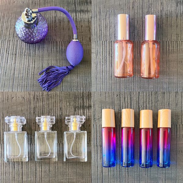 Various groupings of different quantities of colourful glass perfume bottles, purple, pink and clear