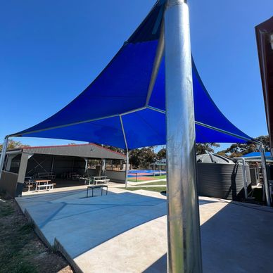 Large Hip and ridge shade structure over outdoor area