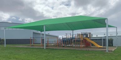 Large Hip and ridge shade structure over playground