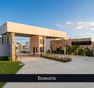 Modern entrance of Boreana residential community with clear skies.