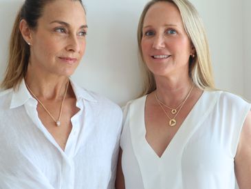 Two women standing next to each other