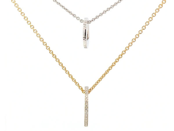 two necklaces with diamonds on them