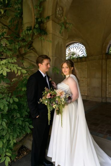 Bride and groom posing on wedding day.