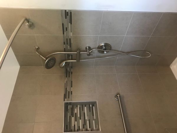 Modern shower with tiled walls and built-in niche.