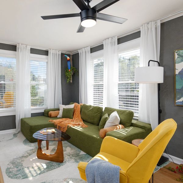 Bright, coastal living space with plenty of natural light. Start your morning here with coffee.