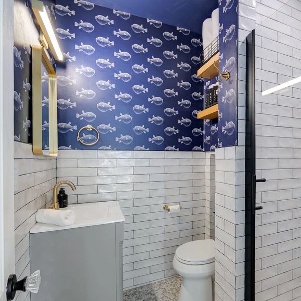Clean, updated bathroom stocked with essentials for your stay.