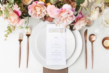 wedding centerpiece flowers at the Meadowlark 1939  beautiful linens and wedding tableware menu card