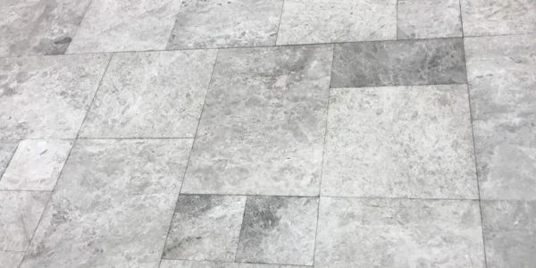 Gray stone tiled floor with varying shades.