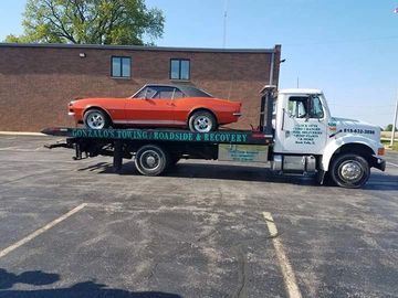 a red car on a white truck