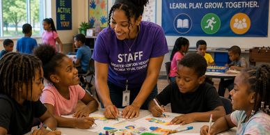 Teacher engaging with children in a colorful classroom activity.