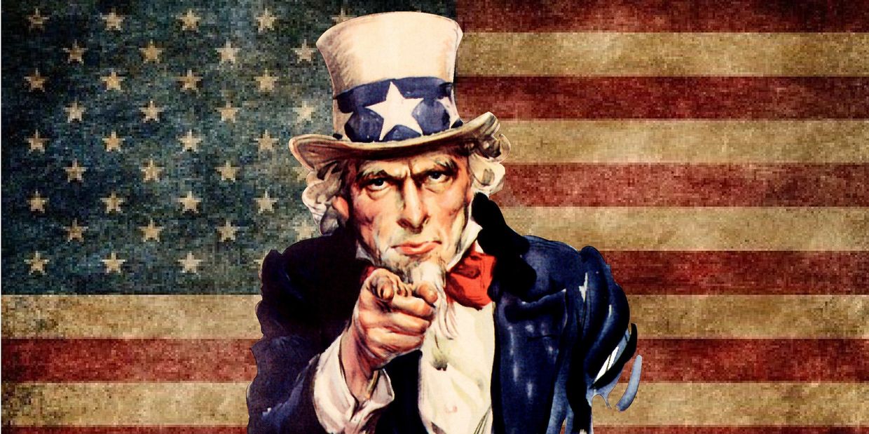 Uncle Sam pointing in front of an American flag.