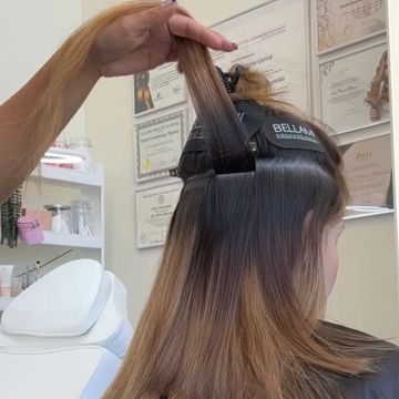 Tape-In: Fine strips of 100% human hair that gently adhere to your natural hair—no heat, no damage.