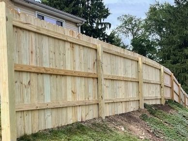 New wooden fence installation