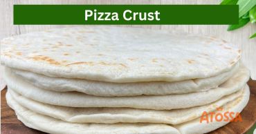 Stack of soft, uncooked pizza crusts ready for toppings.
