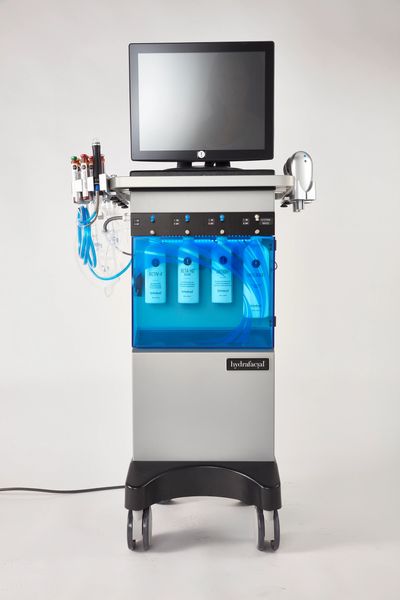 A machine with blue tubes and a monitor