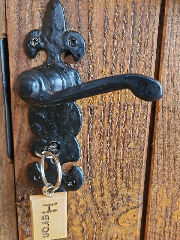 Riverside glamping pod door handle with 'Heron' key tag near Builth Wells Powys Wales by River Irfon