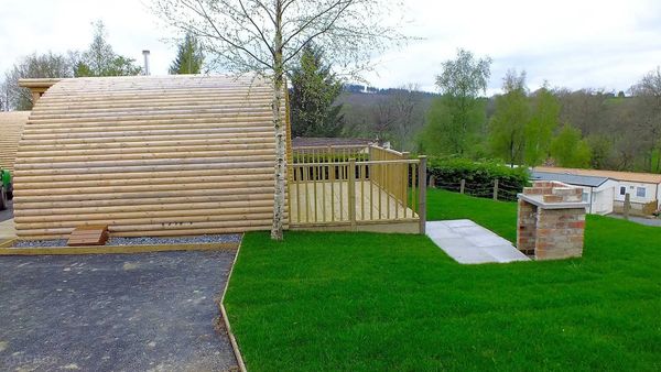 Riverside glamping pod in Powys, Wales – private deck, BBQ, scenic views & peaceful nature escape.