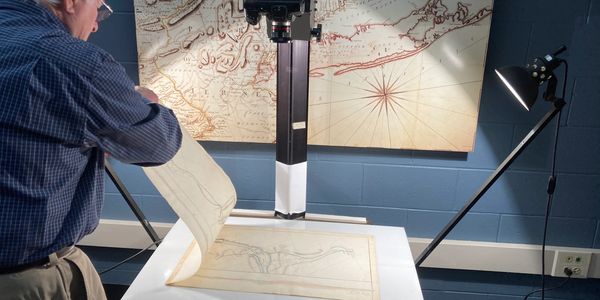 Scanning maps for the documentary film on the Erie Canal. 