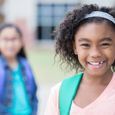 Child with a backpack outdoors