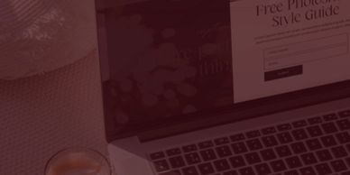 Laptop displaying a free Photoshop style guide next to a cup of coffee on a textured surface.