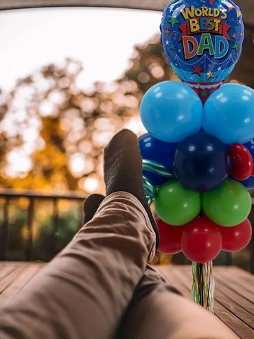 Relaxing with "World's Best Dad" balloons.
