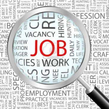Magnifying glass focusing on the word 'JOB' among related employment terms.