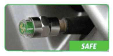 Close-up of a safe tire pressure sensor on a car wheel.