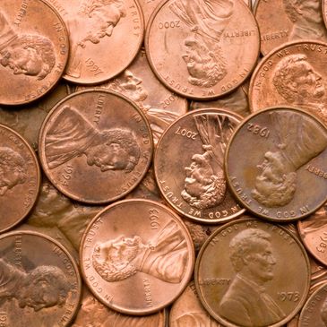 Several pennies to illustrate the price of advertising per reader.