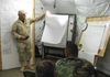 Robert C. Neumann conducting an after action review with a chemical battalion staff