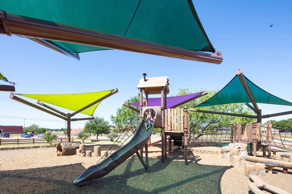Bright shade structures over a public playground