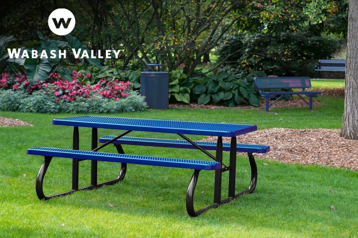 Blue picnic table bench in a park with receptable and benches