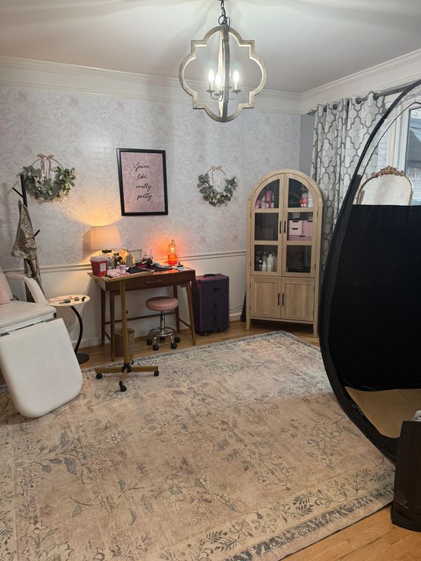 Cozy beauty room with vintage decor, a makeup desk, and a soft rug.