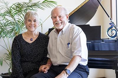 Roger Flygare and his wife Karla sitting at the piano