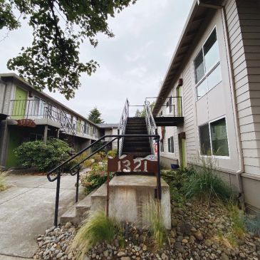 Apartment complex with stairs and address 1321.