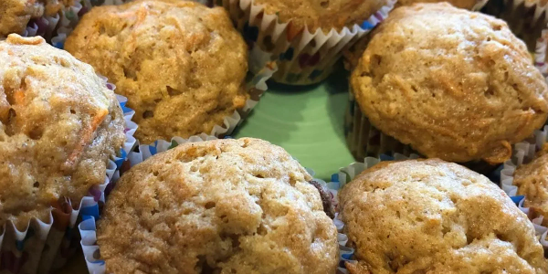 Close-up of freshly baked muffins in paper liners.