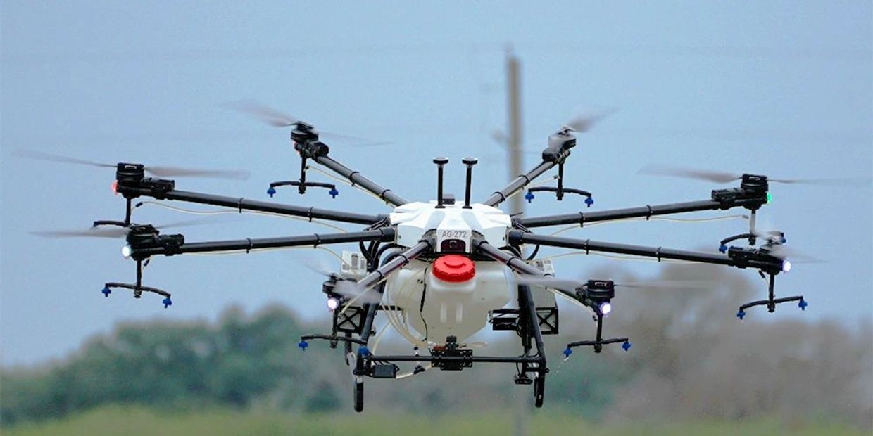 Agriculture drone spraying a field.