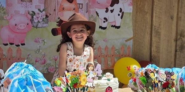 Girl at her birthday party at a petting farm 