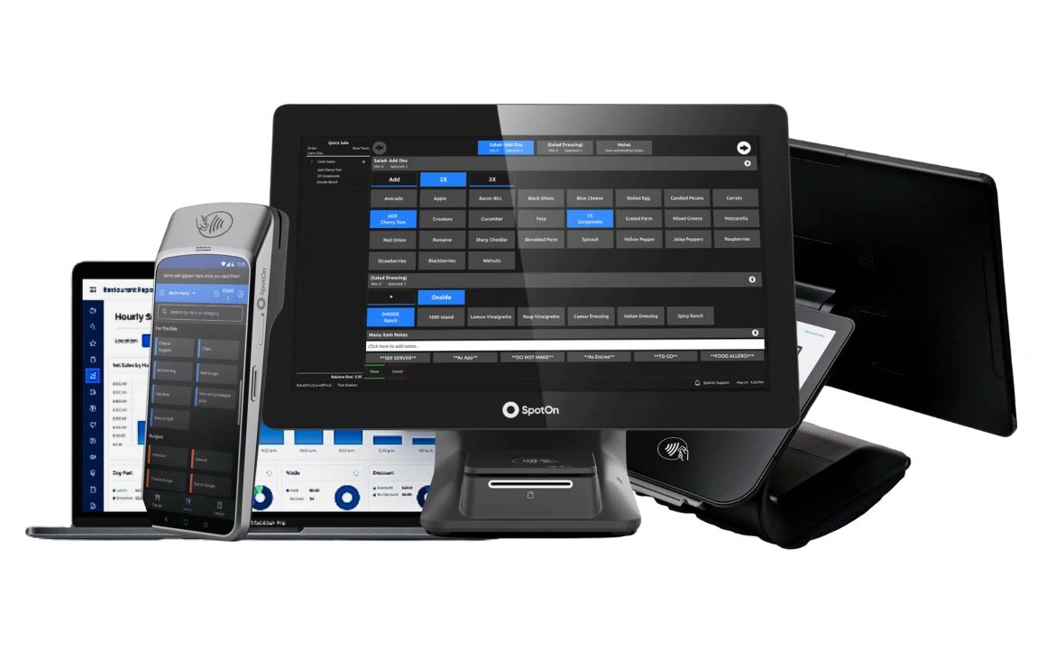 Person in suit holding a smartphone and writing in a notebook.